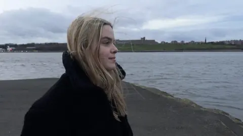 BBC Young Reporter winner Kate stood looking out at the ocean in South Shields