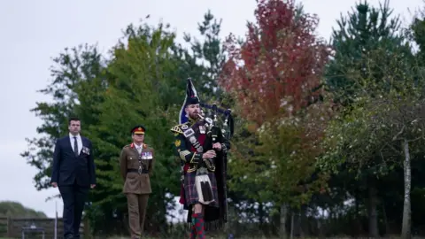 PA Media Piper Major Colour Sgt Peter Grant