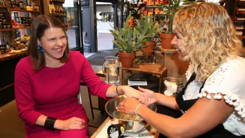 PA Media Jo Swinson at Bournemouth branch of cosmetics chain Lush