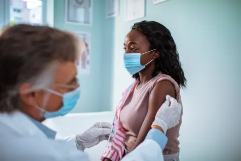 Getty Images woman receiving injection