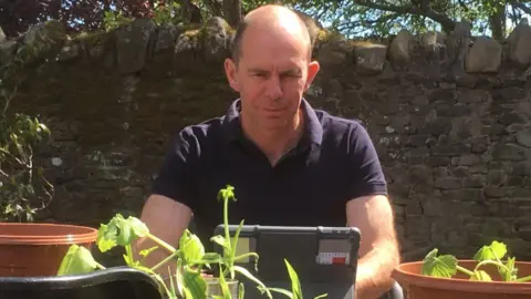 Richard Willan Teacher at an iPad