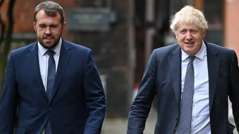 Getty Images Jonathan Gullis and Boris Johnson