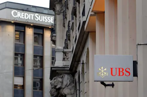 Getty Images The logos of Swiss banks Credit Suisse and UBS