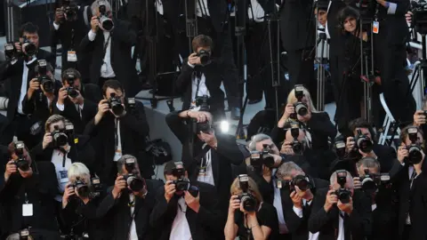 Getty Images Photographers shooting the red carpet at a Cannes Film Festival