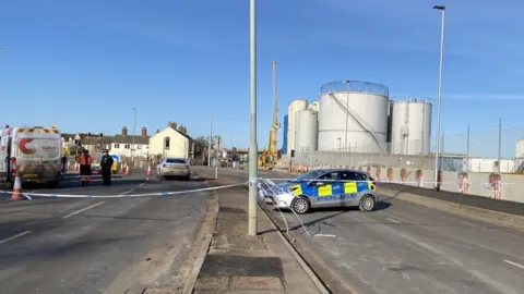 Mariam Issimdar/BBC A police cordon in Great Yarmouth