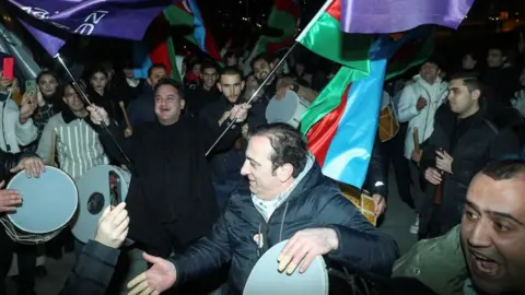 Reuters Crowds took to the streets of the capital Baku to celebrate Ilham Aliyev's fifth consecutive term