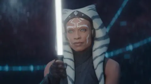 Lucasfilm Ltd. Title character from Ahsoka wielding a lightsaber