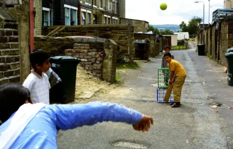 Getty Images Children playing cricket in Bradford in 2001