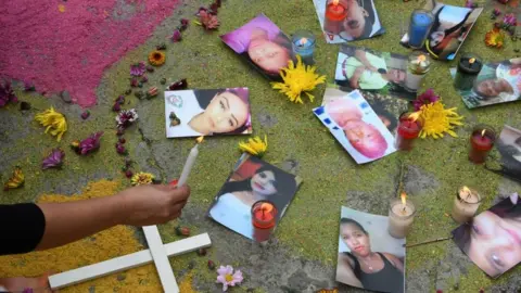 Getty Images Photos of femicide victims during a protest in Tegucigalpa