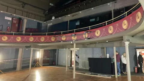 Interior of Oldham Coliseum theatre showing decorative balcony