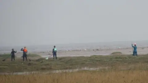 Jim Wright People on the saltmarsh at Cleethorpes