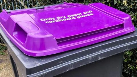 Purple recycling bin