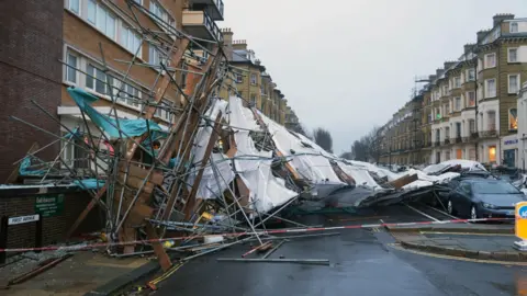 Eddie Mitchell Scaffolding has toppled over in a city street