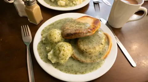 Getty Images Pie and mash served on a plate smothered in parsley liquor