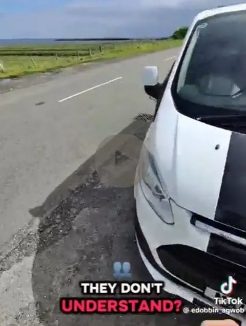 TikTok A caption They don't understand on a grab of a TikTok video showing Margerision returning to his van