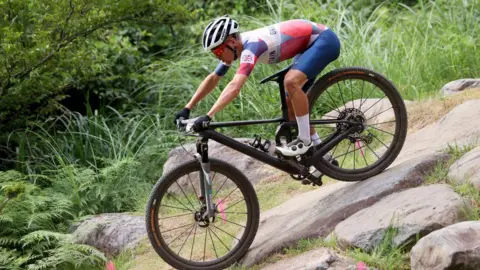 Tom Pidcock competing in the mountain bike at the Tokyo 2020 Olympics