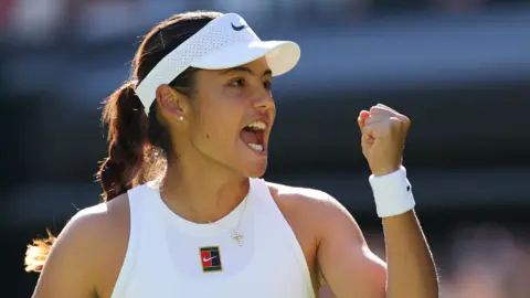 Emma Raducanu celebrates while playing first-round match at Wimbledon