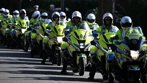 Getty Images a line of police officers on motorbikes