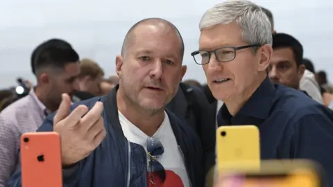 VCG Sir Jony Ive and Apple chief executive Tim Took.