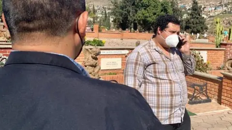 Marcos González/BBC Antonio Maya and his police escort