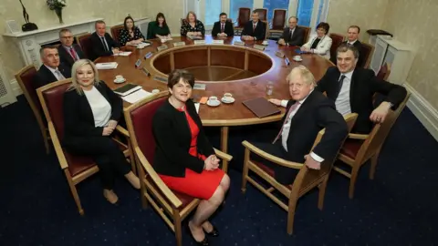Getty Images Boris Johnson meeting the new executive ministers at Stormont Castle in January 2020