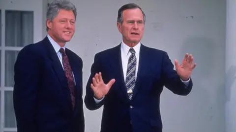 Getty Images President Bush and President Clinton