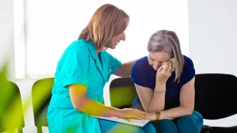 Getty Images Woman with psychologist