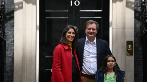 Getty Images Nazanin Zaghari-Ratcliffe with her husband Richard and daughter Gabriella outside Downing Street