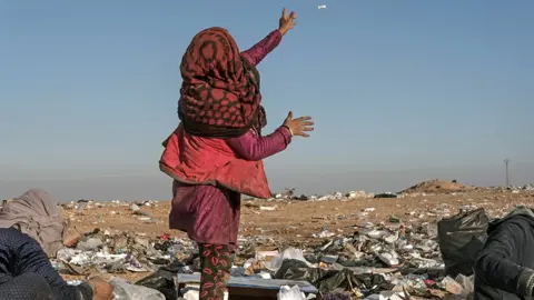 Gabriel Chaim Walaa points at a US surveillance drone overhead