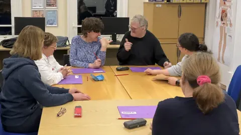 BBC Students sat around a table