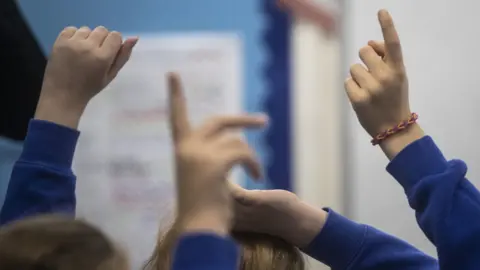 PA Media School children during a Year 5 class at a primary school