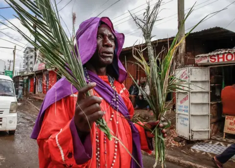 Getty Images Members of the Legio Maria Church march along the streets of Kibera during a Palm Sunday celebrations on April 2, 2023 in Nairobi, Kenya.