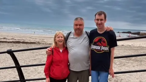 Annette Hill A photo of Annette, Michael and Annette's partner, Stewart