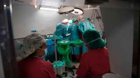 Getty Images Surgeons working in Spain