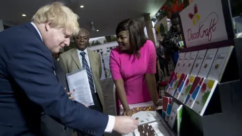Getty Images British Foreign Secretary Boris Johnson (L) meets with Ghanian businessmen at British Embassy in Accra,