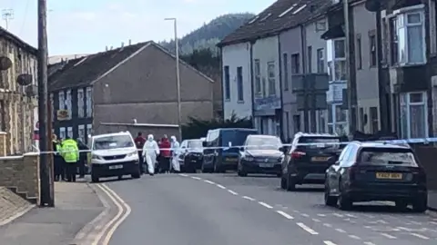 Police officers and emergency crews Baglan Street in Ynyswen, Rhondda