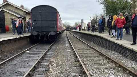 People standing on railway platforms