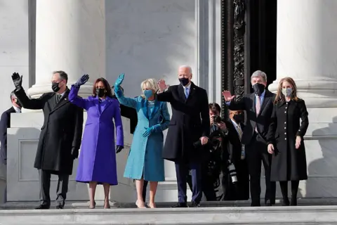 Mike Segar / Reuters Joe Biden and Kamala Harris, with their spouses