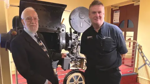 Former manager Eddie Poole and current manager Andrew Poole.