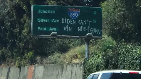 Some anti-Biden graffiti on a San Francisco highway sign.