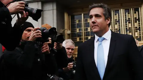 Getty Images President Donald Trump"s long-time personal attorney Michael Cohen exits a New York court on April 16, 2018 in New York City.