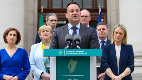 EPA-EFE/REX/Shutterstock Leo Varadkar resigning with Fine Gael ministers behind him