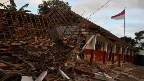 Reuters A collapsed school building in Cianjur, West Java