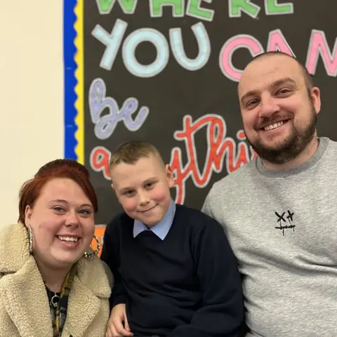 Aydn with his mum Leanne and dad Liam