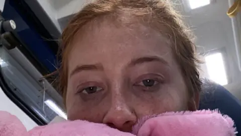 Alice Jenkins A woman with red hair looking directly into the camera