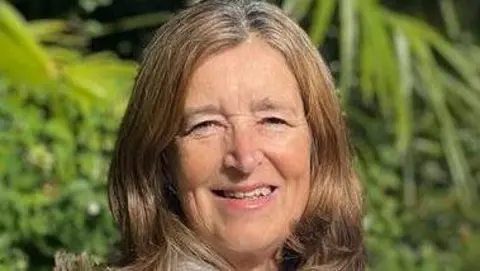 Central Bedfordshire Council A head and shoulders shot of a woman with light blonde/brown hair in a centre parting. She is wearing a white blouse with a light grey cardigan.