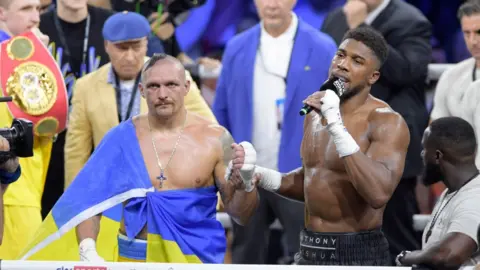 Getty Images Anthony Joshua addresses the crowd after his defeat to Oleksandr Usyk