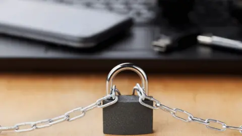 Getty Images Padlock with devices in background