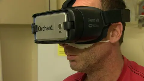 A patient wearing a virtual reality headset