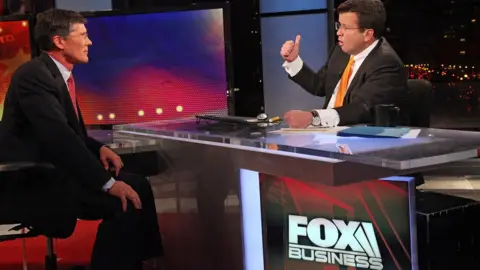 Getty Images FOX Business Network's Neil Cavuto (R) interviews former Merrill Lynch Chief Executive and current head of CIT Group John Thain at FOX Studios on October 27, 2011 in New York City.